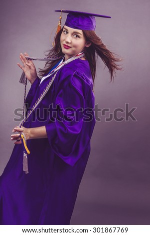 Portrait of female graduation during fashion shots.
