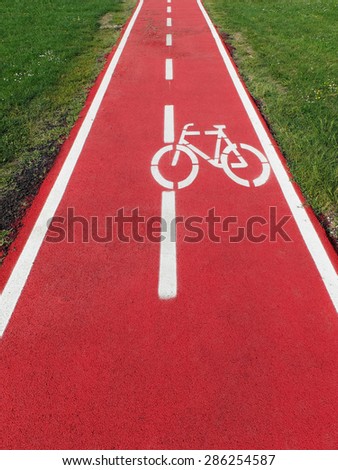 Similar – Foto Bild Radweg mit roter Fahrbahnmarkierung bei winterlichen Straßenverhältnissen.