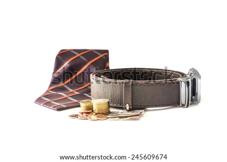 men\'s accessories: tie, belt and money on white background