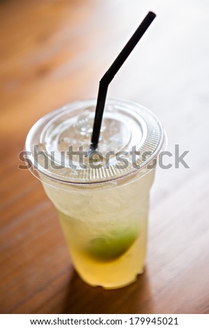 Iced lemonade soda in plastic cup
