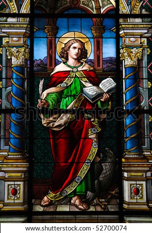 Saint John the Evangelist. Stained glass window created by F. Zettler (1878-1911) at the German Church (St. Gertrude\'s church) in Gamla Stan, Stockholm.