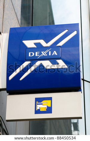 BRUSSELS, BELGIUM – CIRCA 2009: Logo of Dexia Bank in the Wetstraat in Brussels. This bank was saved in October 2011 by the Belgian government, one of the most notable events in the Euro debt crisis.
