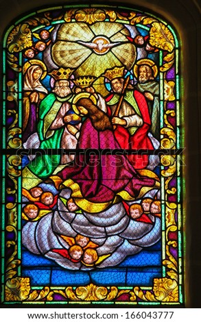RONDA, SPAIN - DEC 1: Stained glass window depicting the Assumption of the Virgin Mary, in the church of Ronda, Spain, on December 1, 2013.