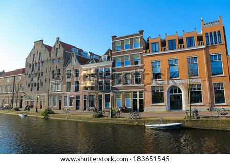 LEIDEN, THE NETHERLANDS - MARCH 16, 2014: The famous Old Rhine going through the center of Leiden, The Netherlands.