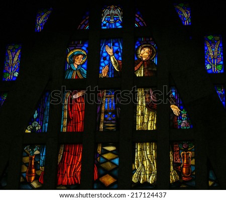 GUIMARAES, PORTUGAL - AUGUST 7, 2014: Stained glass window depicting The Visitation, Mother Mary meeting with her niece Elisabeth, in the Sanctuary of the Rock in Guimaraes, Portugal.