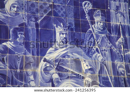 PORTO, PORTUGAL - JUNE 4, 2014: Azulejo panel in the Sao Bento Railway Station in Porto, Portugal. This panel was created around 1900 and depicts king Alfonso VII of Leon.