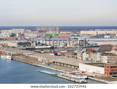 ANTWERP, BELGIUM - MARCH 7, 2015: View on warehouses by the River Scheldt in the port of Antwerp, Belgium.