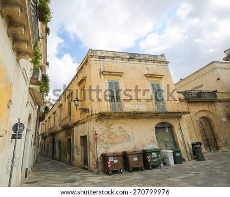 LECCE, ITALY - MARCH 13, 2015: Old houses in the typical yellow Lecce stone in the old center of Lecce, a historic city in Apulia, Southern Italy
