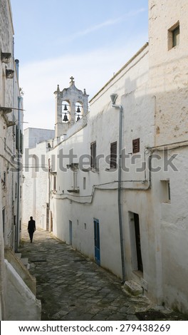Narrow alley in the center of the medieval town Ostuni in Puglia, South Italy.