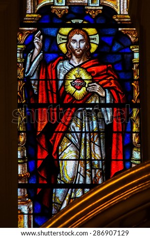 MALAGA, SPAIN - NOV 29, 2013: Stained glass window depicting the Sacred Heart of Jesus Christ, in the cathedral of Malaga, Spain.