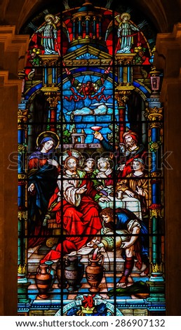 MALAGA, SPAIN - NOV 29, 2013: Stained glass window depicting Jesus and Mary at the Wedding at Cana, in the cathedral of Malaga, Spain.