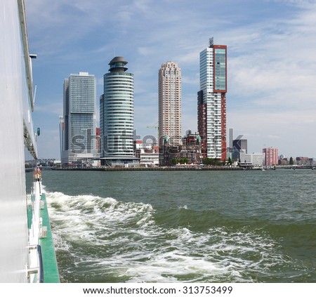 ROTTERDAM, THE NETHERLANDS - AUGUST 9, 2015: Residential skyscrapers at Kop van Zuid neighborhood in Rotterdam, by the Nieuwe Maas in South Holland, The Netherlands.