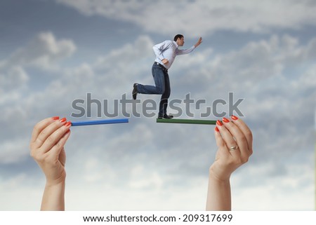 Casual business man running and jumping after opportunity