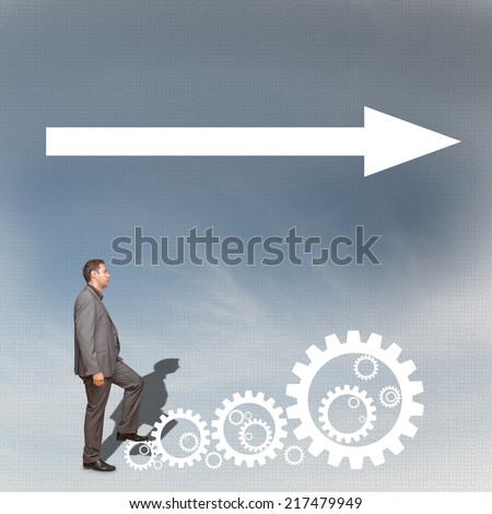 Businessman climbing gears and going in one direction. Success concept