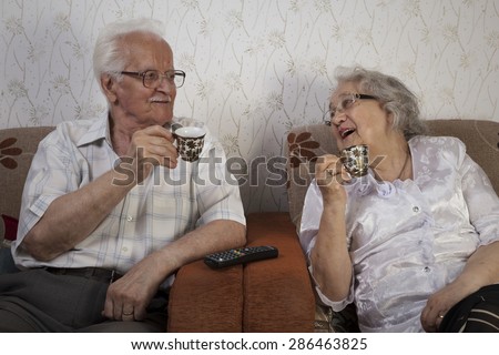 Happy senior couple drinking their morning coffee