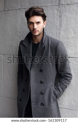 Young handsome man in coat