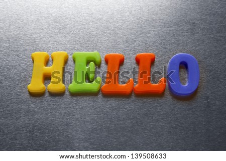 hello word spelled out using colored fridge magnets