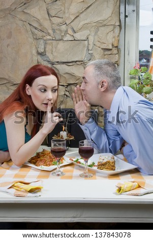 Man share a secret - Restaurant scene