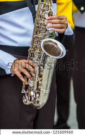 Jazz band playing in the street-oriented selection in hand with saxophone.