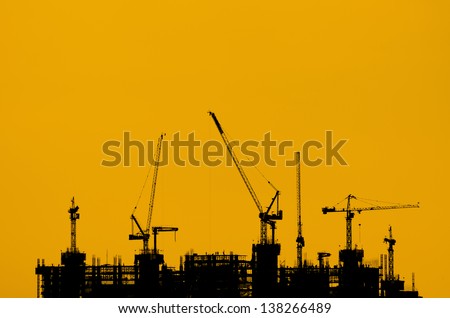 Silhouette crane construction industry and building work.