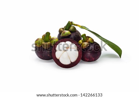 Mangosteen and cross section showing the thick purple skin and white flesh of the queen of friut.
