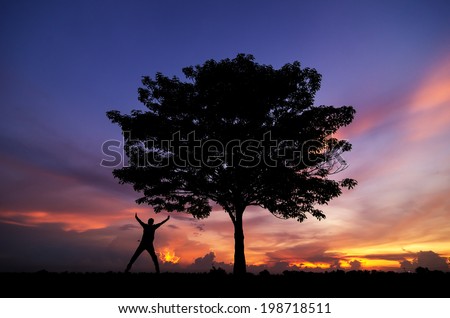 Beautiful landscape with silhouette of trees and men happy. Beautiful sunset sky