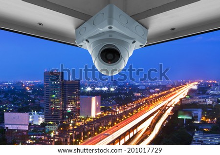 The security cameras on a balcony high building. View traffic at night
