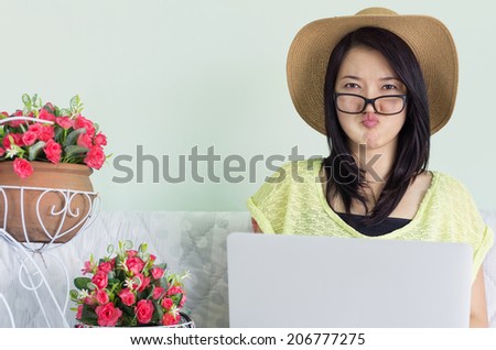 Stress young beautiful asian woman using a laptop on the bed indoor.