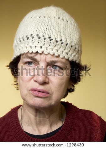 Woman wearing winter hat. Old woman