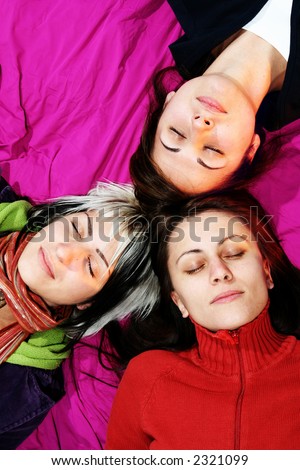 Women friends sleeping. Three friends laying with closed eyes