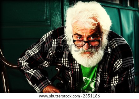 Old man portrait. Old man with grey beard color manipulated