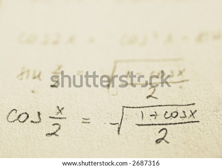 Math and school concept. Formulas on old yellow paper
