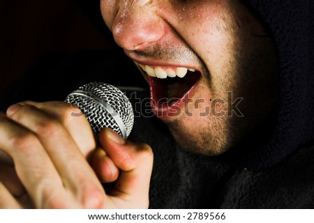Man with microphone. Music singer rage with microphone. Live music concept