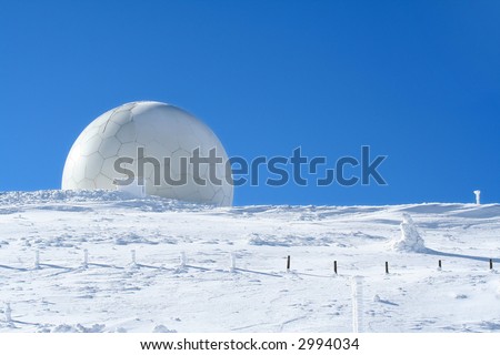 Weather station, high on a mountain top under snow. Meteorology concept