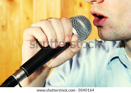Singing in microphone. Music singer. Rock concept