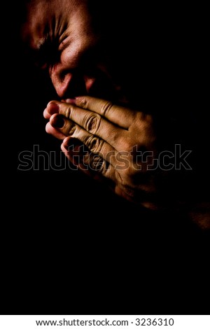 Praying in darkness concept. Pain, anger and grief face expressions