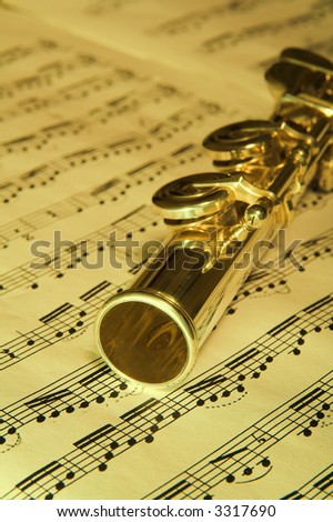 Gold Flute and notes in background. Classic music concert concept