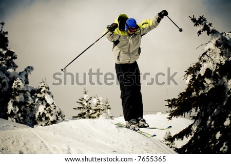 Skier in a jump in speed. Winter sports concept