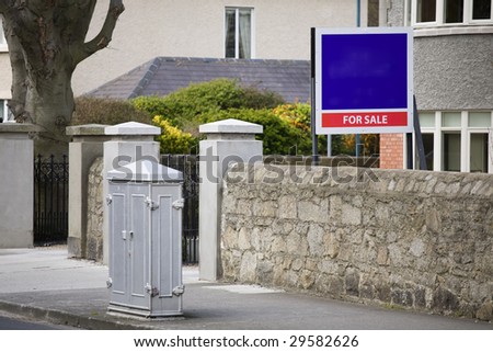 House for Sale with empty sign in front. Real estate concept
