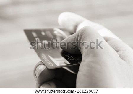 Credit card in hand or Pay by card