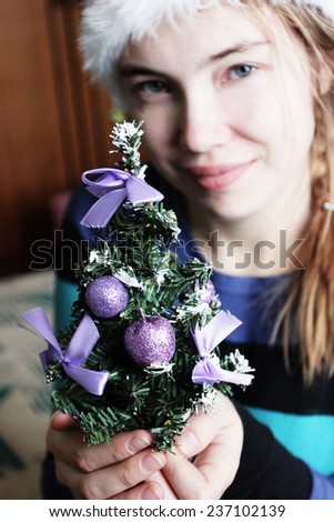 a Christmas tree, Fir tree, Tree in hands, Holiday background, Merry Christmas, Happy new year