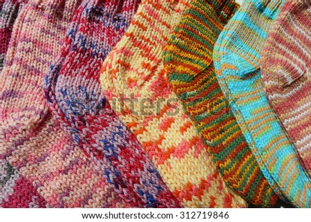 Knitted socks or Sweet home, Cozy background, Fall, Holidays, at home on laptop, Knitted background