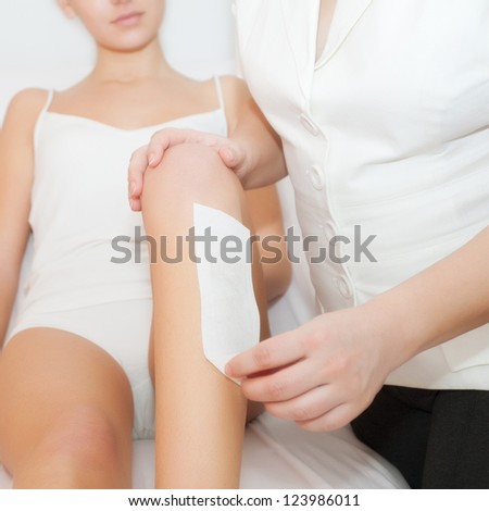Women waxing legs