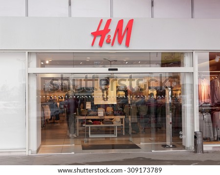 BUCHAREST, ROMANIA - AUGUST 22, 2015. H&M store in Militari Shopping, Bucharest. H&M Hennes & Mauritz AB is a Swedish multinational retail-clothing company with over 3500 stores in 57 countries.
