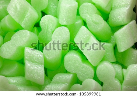 A green packing styrofoam peanuts as a background