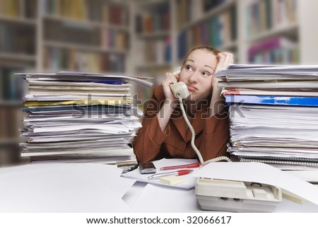 businesswoman calling by phone - office scene