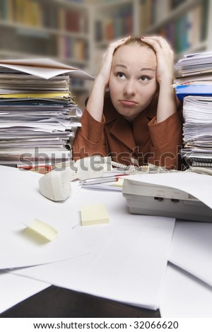 tired and frustrated businesswoman at the desk in the office