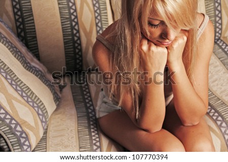 girl frustration crying lying in chair