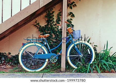 vintage bicycle on vintage wooden house wall