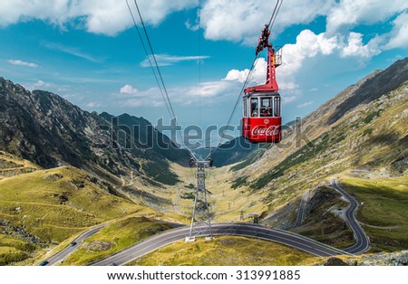 Transfagarasan, Romania - September 5, 2015: Photo of transfagarasan road and cable way with coca-cola logo. Transfagarasan mountain road considered one of the most beautiful roads in the world.